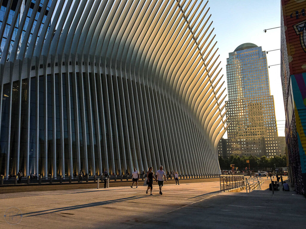 This is an image of the Oculus from the side at sunset.