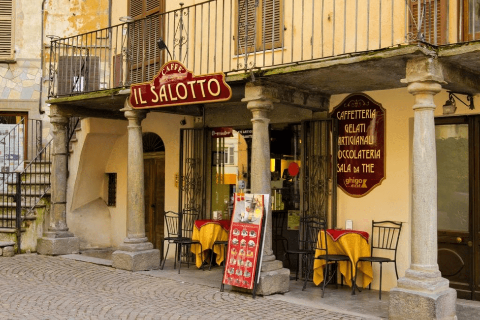 This is an image of a restaurant with tables sitting outside in Rome, Italy.