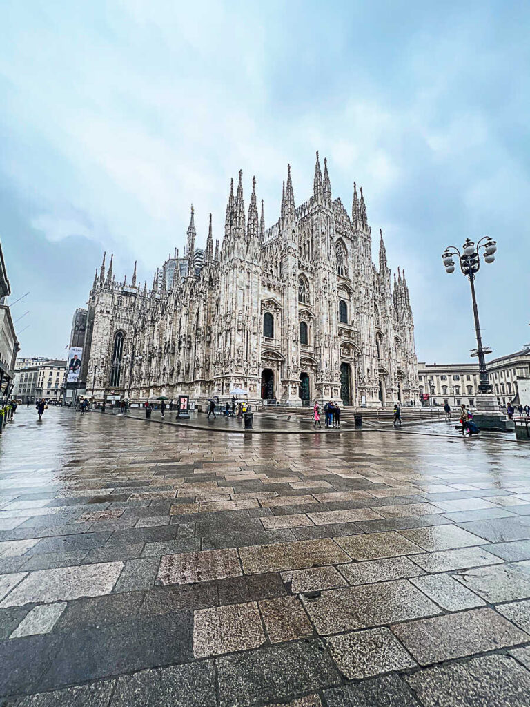 This is an image of the cathedral in Milan, Italy, on a rainy day.