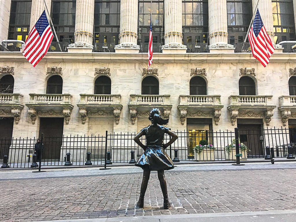 This is an image of the Fearless Girl in front of the New York Stock Exchange in New York City NYC.